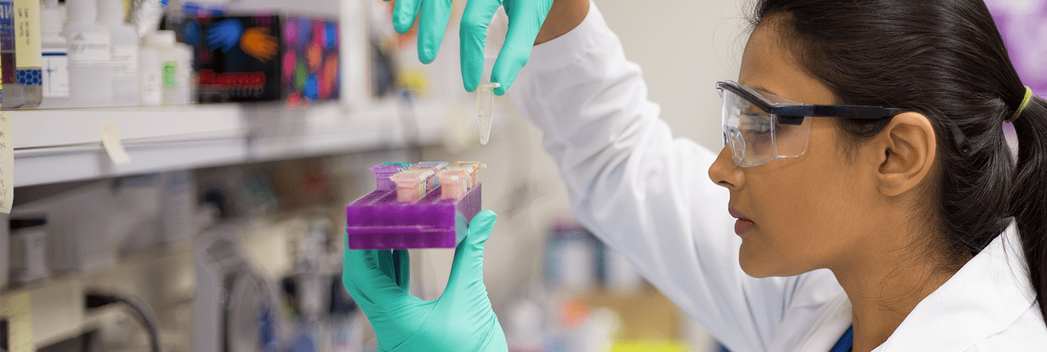 woman testing blood in lab