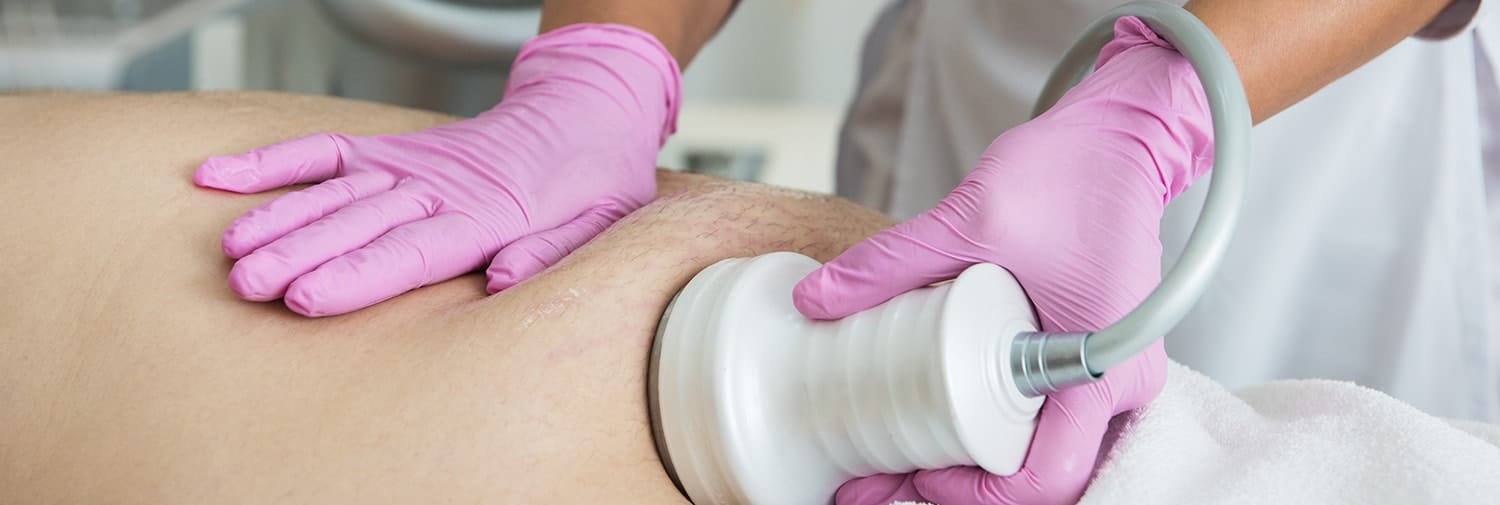 man receiving ultrasonic cavitation procedure