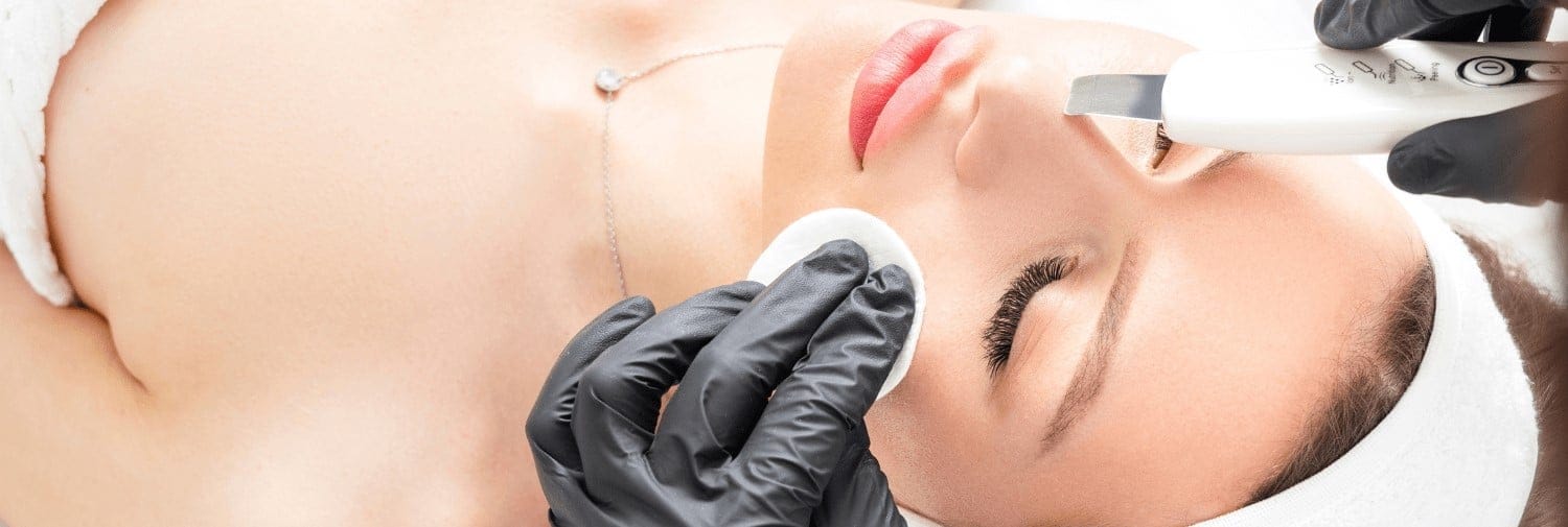 doctor performing a chemical peel treatment