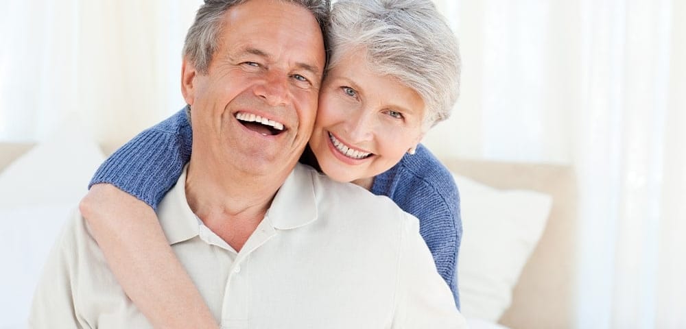 woman holds onto man who is dealing with erectile dysfunction