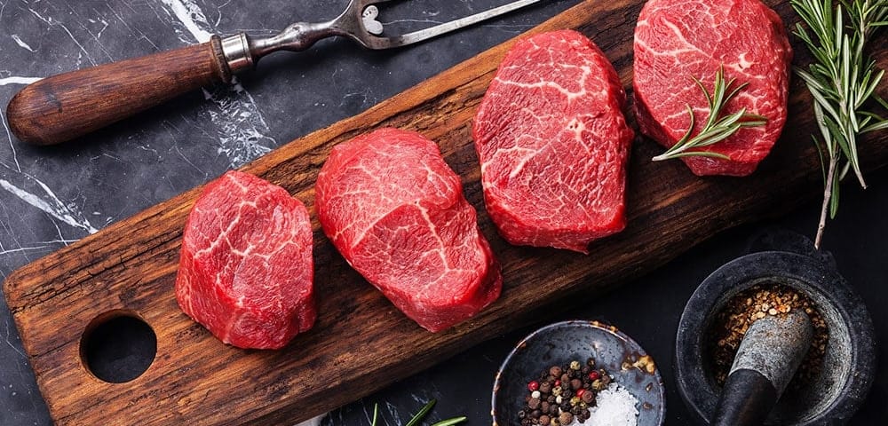 tray of steaks ready to be prepared