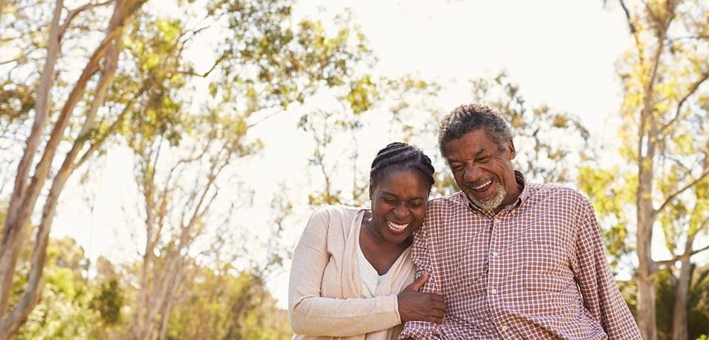 older couple strolling in park together