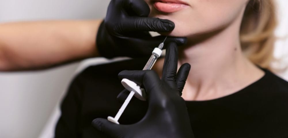 woman receiving chin botox in greenwood, in