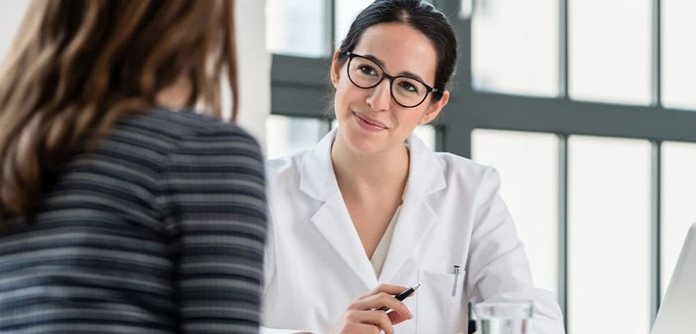 a woman talking to her new primary care physician