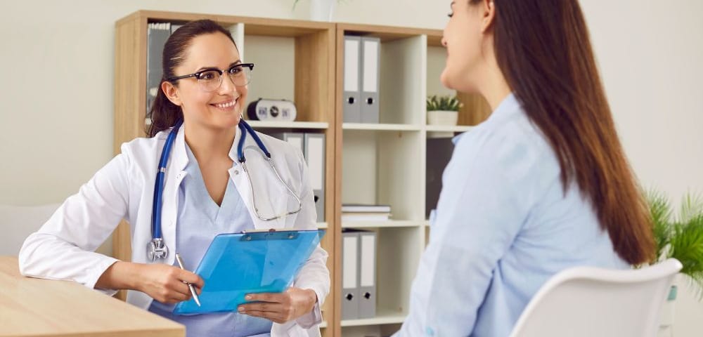 Doctor talking to patient at executive physical