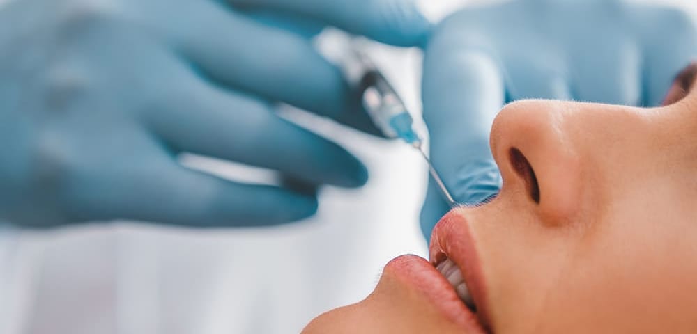 a woman receiving botox injections