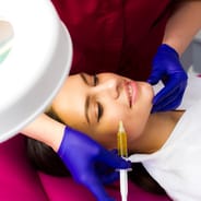 woman getting vampire facial