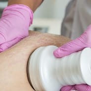 man receiving ultrasonic cavitation procedure