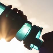 woman drinking water for hydration