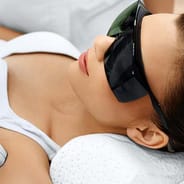 woman receiving underarm laser hair removal treatment