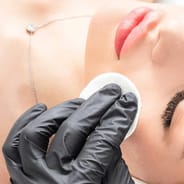 doctor performing a chemical peel treatment