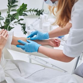 A doctor performing iv therapy