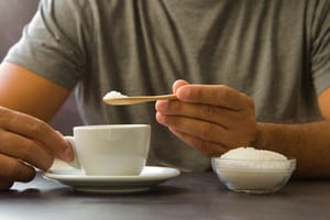 man adding processed sugar and contributing to sugar and inflammation in his body