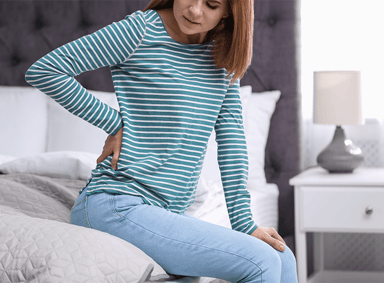 woman struggling with back pain