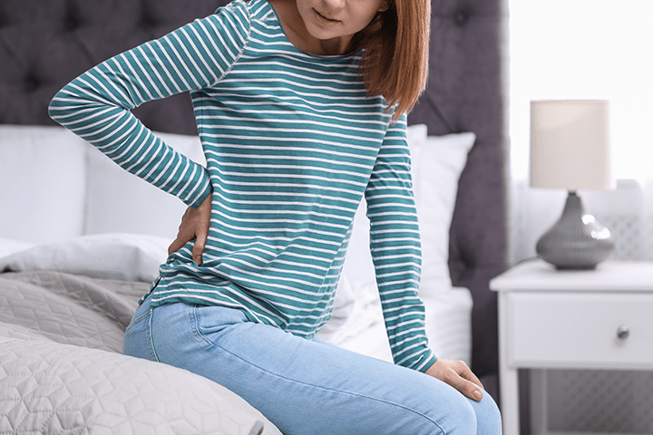 woman struggling with back pain
