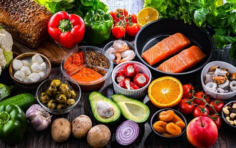 Foods that are in the Mediterranean Diet like fruits and vegetables, nuts, and fish.