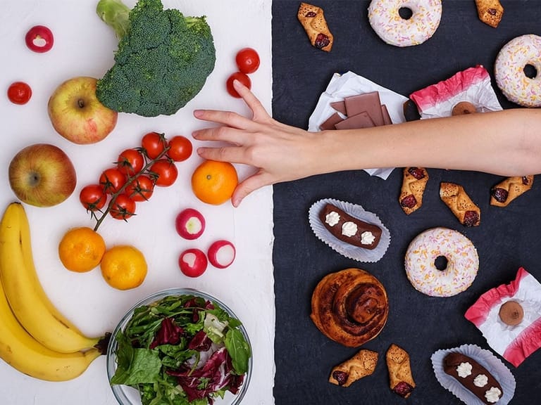 hand reaching for healthy alternative to stress eating junk food