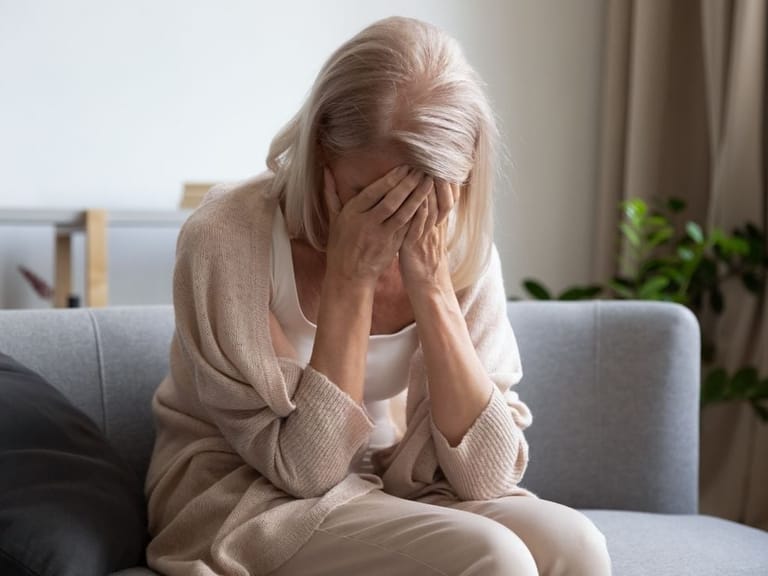 older woman suffers through the symptoms of hormone imbalance