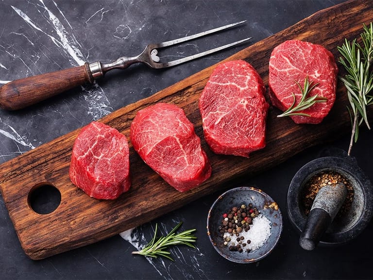 tray of steaks ready to be prepared