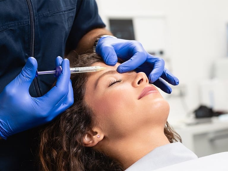 woman receiving forehead Botox at the doctor's office