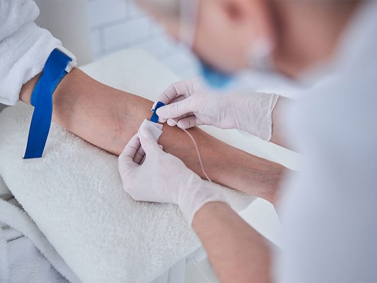 specialist administering iv drip for weight loss