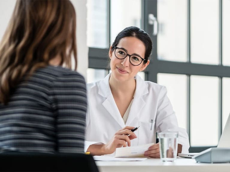 a woman talking to her new primary care physician