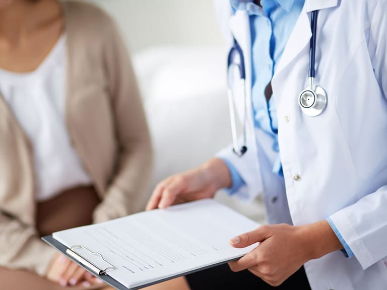 a boutique doctor holding a clipboard