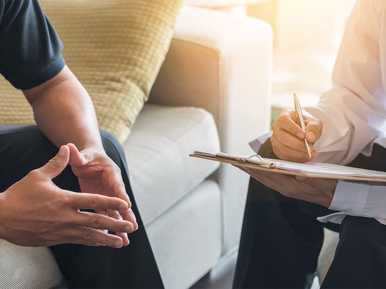 a doctor consulting with a male patient