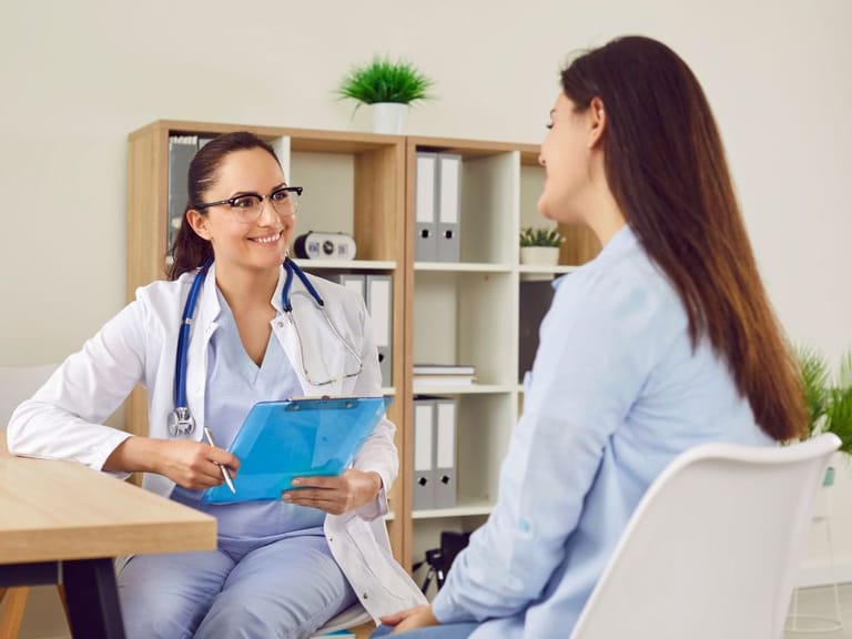 Doctor talking to patient at executive physical