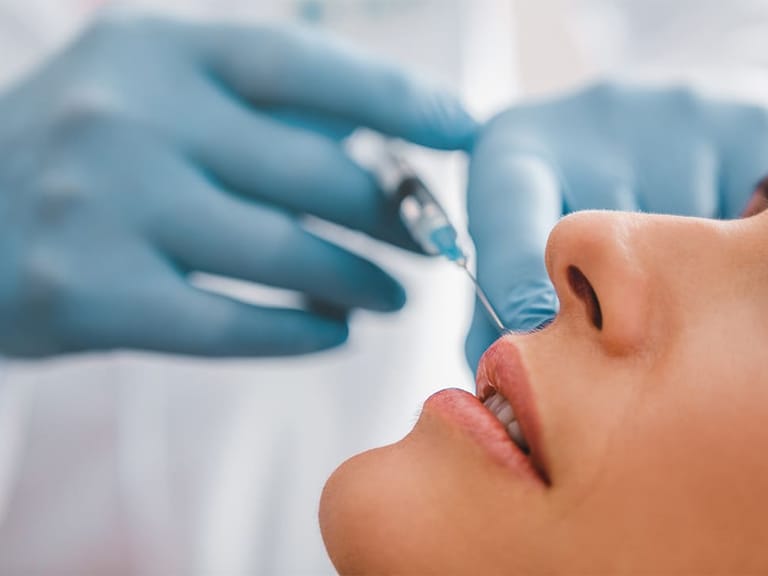 a woman receiving botox injections