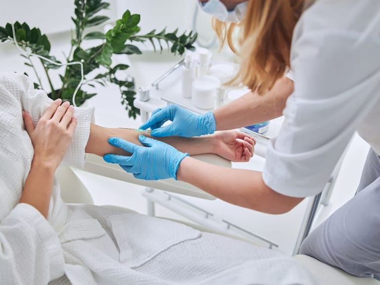 A doctor performing iv therapy