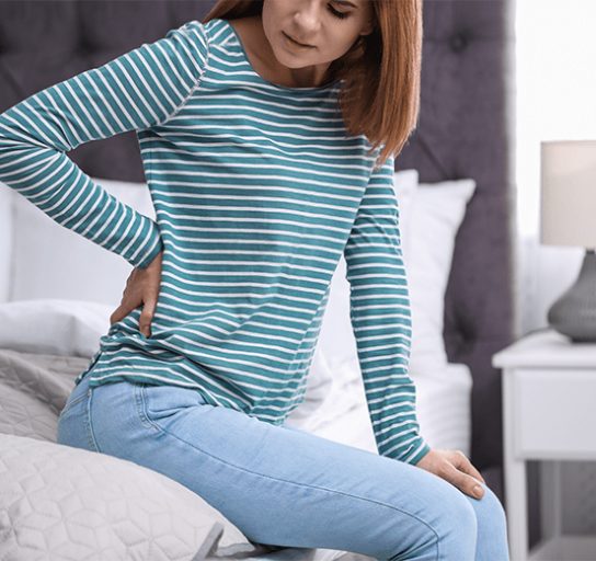 woman struggling with back pain
