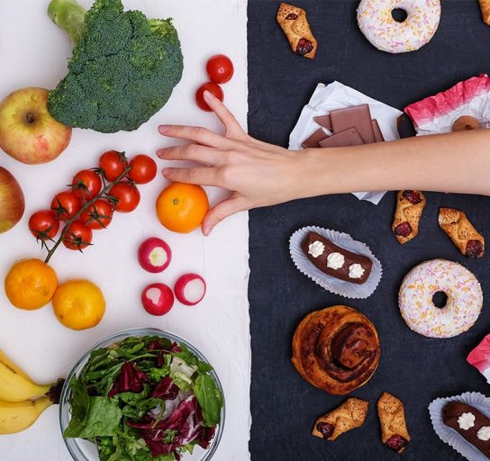 hand reaching for healthy alternative to stress eating junk food