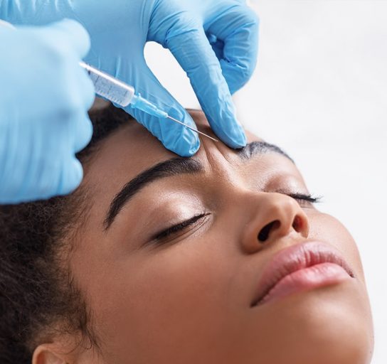 woman receiving botox treatment between eyebrows in indianapolis, in