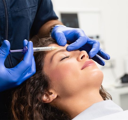 woman receiving forehead Botox at the doctor's office